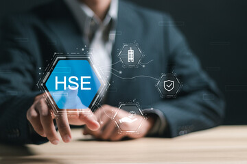 HSE, Health safety environment concept. Businessman touch virtual HSE icon for business and...
