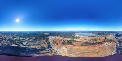 Aerial drone view of Corta Atalaya with mining levels at open mine pit. Deep excavation of pyrite...