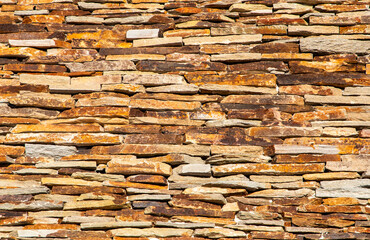 A wall made of decorative stone slabs