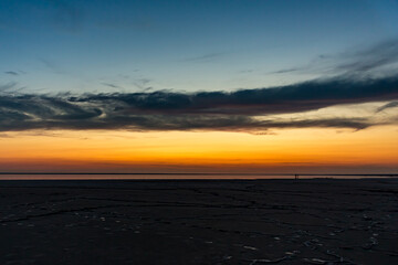 Sunset or sunrise on salt lake Elton (Russia) Tall altocumulus and cirrocumulus clouds against the...