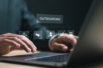 Outsourcing concept. Human resources and global recruitment for business. Businessman use laptop...