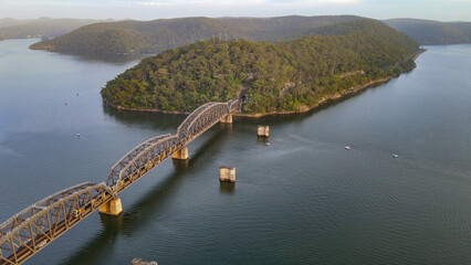 Aerial drone view of Hawkesbury River Train Bridge on the Hawkesbury River, NSW Australia showing a...