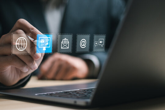 Email marketing and newsletter advertising concept. Businessman use laptop with virtual Email marketing for business e-mail communication and digital marketing.