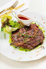 steak with sauce and vegetables