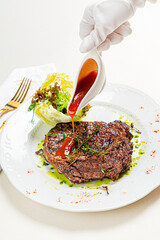 steak with sauce and vegetables