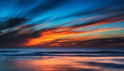 Sea sunset on beach. Sky of blue and orange colors. Coastal wallpaper.
