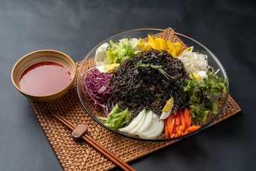 Korean food, jokbal, pork, pork feet, bossam, boiled pork, side dishes, kimchi, steam, marinade, lettuce, vegetables, salted shrimp,