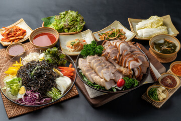 Korean food, jokbal, pork, pork feet, bossam, boiled pork, side dishes, kimchi, steam, marinade, lettuce, vegetables, salted shrimp,