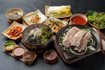 Korean food, jokbal, pork, pork feet, bossam, boiled pork, side dishes, kimchi, steam, marinade, lettuce, vegetables, salted shrimp,