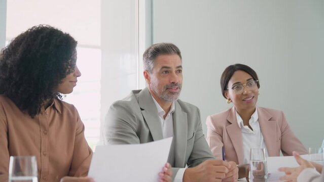 Happy busy executive team, diverse office workers people having business meeting, consulting client, hr recruiting group having onboarding interview, providing consultancy services in office.