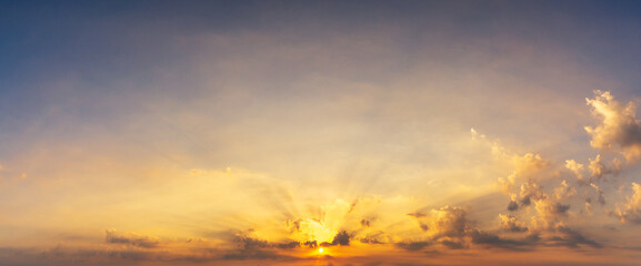 nature panorama background golden cloudy sky and yellow sun with silver lining