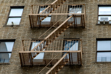 Facade of a typical building with emergency stairs in the Bronx neighborhood of New York City, one...