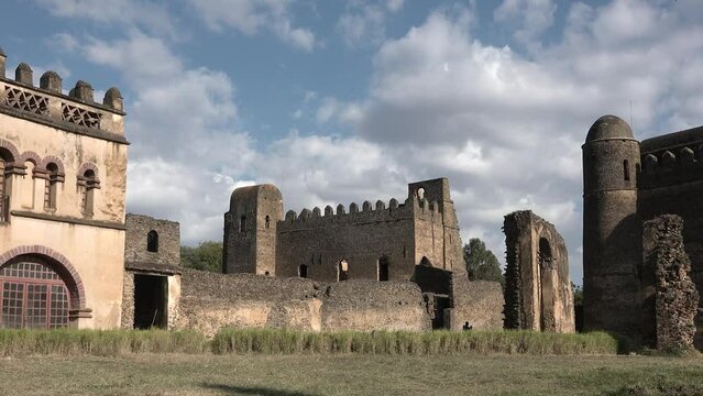 A stone ruins of medieval castle. Historic fortress in Gondar, cultural heritage and famous monument in Ethiopia. Unesco world heritage. Building, old architecture.