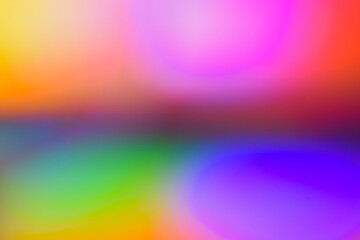 Holographic abstract background photo. Bright colourful gradient in pink, red, yellow, purple, blue and red with soft blur effect. Blurred hologram effect.