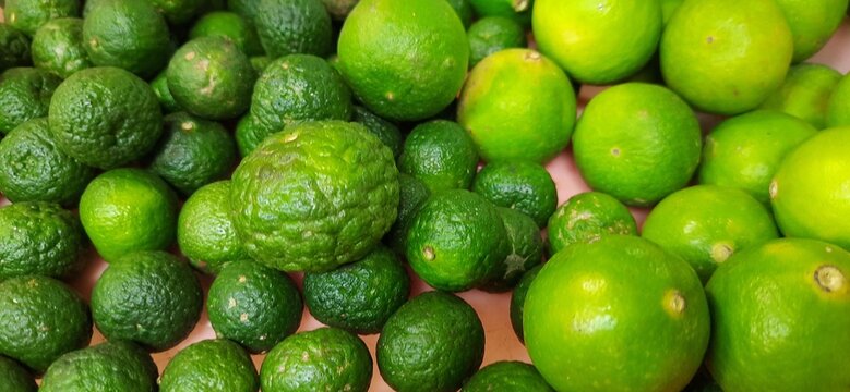 Many of green lemon. Different jeruk nipis and jeruk limau background.Sold in Indonesian local market
