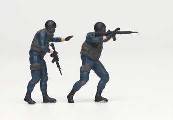 A picture of miniature anti terrorist force on white background.
