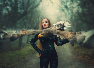 art portrait real people fantasy woman assassin holding white-tailed eagle bird flaping open wings...