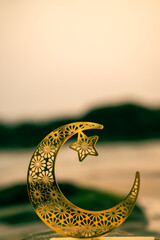 Crescent moon shape on the beach with sunset sky, 2024 Eid Mubarak concept, Ramadan background image
