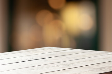 3D rendering, wooden top table with bokeh light effect and blurred cafe restaurant in the...