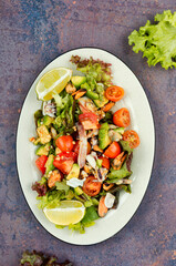 Homemade seafood salad with fish mussels, octopus.