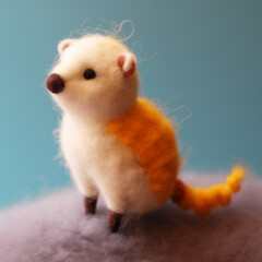 A felted figurine of a white and orange ferret. A cute mink toy made of wool. AI-generated