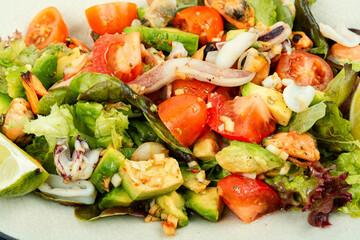 Vegetable salad with seafood.