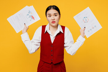 Young puzzled sad lawyer employee business woman of Asian ethnicity wear formal red vest shirt work...