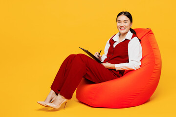 Full body young lawyer employee business woman wearing red vest shirt work at office sit in bag...