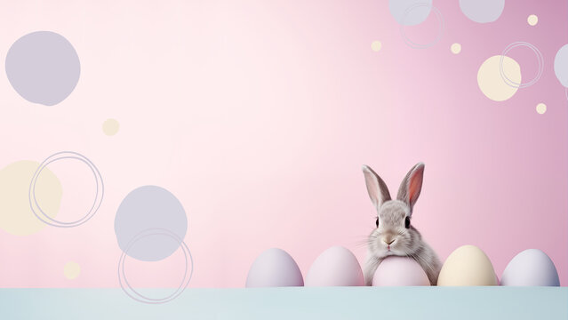 Easter bunny sits near eggs on a light pink background, Easter