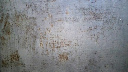 Grungy concrete wall texture with scratched paint.