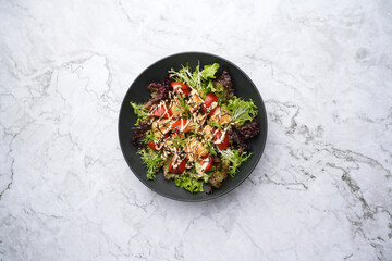 Seafood salad with fresh vegetables greens and fish
