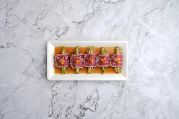 Tuna appetizer with soy sauce. Japanese tiradito tuna, salmon