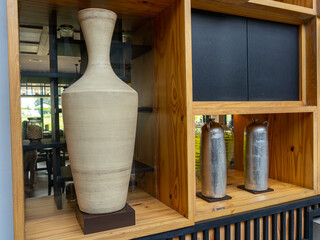 A Tall Light Cream-Colored Pottery Jar with Subtle Horizontal Thin Line Textures