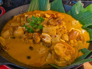 A Serving Plate Containing Beef Knuckle Curry with Thick Broth