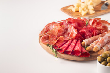 Charcuterie board. Antipasti appetizers of meat platter with salami, prosciutto crudo or jamon and olives.