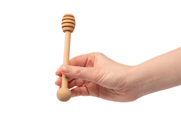 Honey dipper in woman hand isolated on a white background.