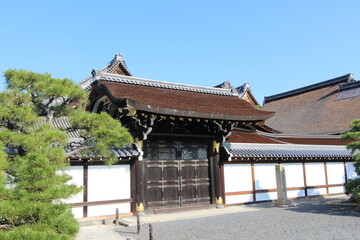 Shoin Gate in Nishi Hongwanji Temple, Kyoto, Japan (Japanese words on the stone statue mean "Hongwanji Temple, the place where Emperor Meiji visited")