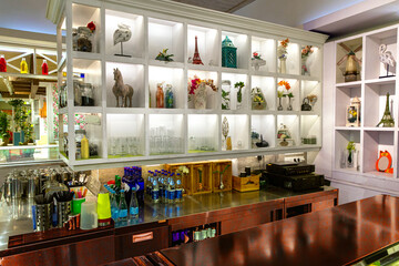 Interior of a cozy restaurant with fresh flowers and light interior