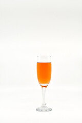Flute glass of pink champagne isolated on a white background. Copy space, No people.