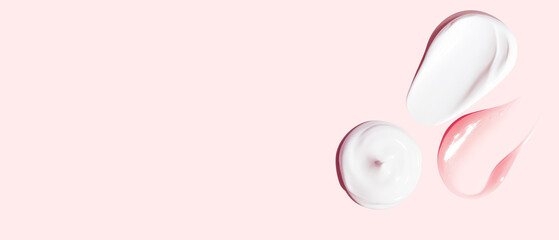 Set of white and pink cream strokes on a pink background. empty space