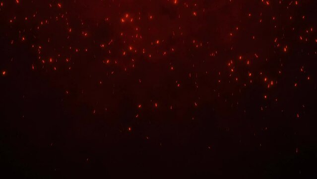 Fire embers particles over black background. Fire glitter particles background.	