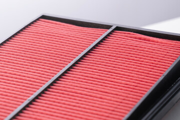 Air filter for internal combustion engine close-up. Paper air filter of car engine isolated on...