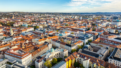 Fototapeta na wymiar Urban city view of Graz in Austria. Aerial panoramic view.