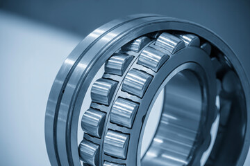 Close up scene the disassembly spherical roller bearing parts in the light blue scene.