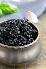 delicious appetizer black caviar in a bowl