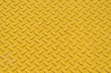 yellow metallic background with embossed textures forming spikes