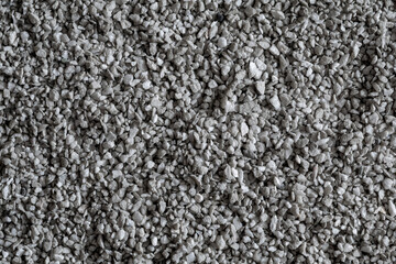 Gray Gravel Texture. Background with Dark Gray Fine Stones. Tiny Crushed Stone Surface. Top View Texture of Small Rocks. Gray Gravel Tiny Stones.