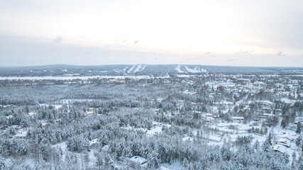 Fototapeta na wymiar Aerial view of snowy Rovaniemi Lapland in Finland. Whiteness of Lapland with Christmas spirit.