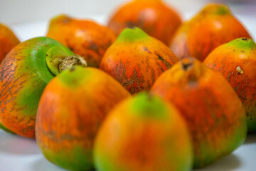 Rare and exotic fruit of the peach palm (Bactris gasipaes), typical fruit of the Brazilian tropical forests, Amazonas, Pará, Rondônia and Acre