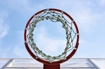 Empty basketball hoop basket over blue sky